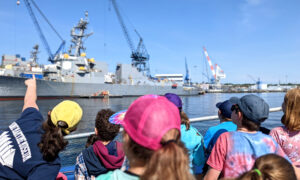 Kids learning about a battleship on a boat: Photo Credit: Maine Maritime Museum