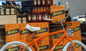 Aperol Liquor display with orange bike; Photo Credit: Cameron Graham/Bow Street Beverage