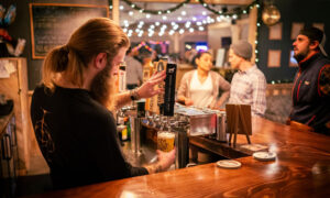 Bartender pouring beer; Photo Credit: Nate Davis
