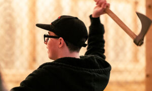 Person mid axe throw; Photo Credit: Nate Davis