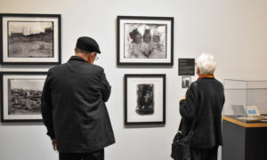 Person looking at maritime exhibits: Photo Credit: Maine Maritime Museum