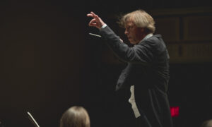 Eckart directing Orchestra during concert; Photo Credit: Sarah McCullough / Portland Symphony Orchestra.