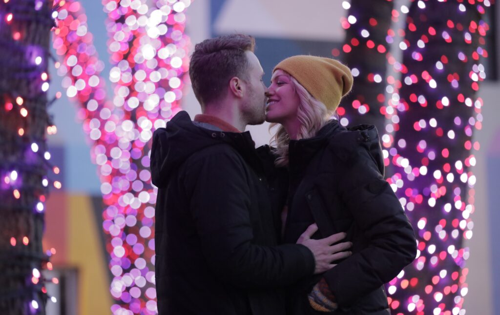 Couple in front of Pandora Christmas lights, Photo Credit: Knack Factory Couple in front of Pandora Christmas lights, Photo Credit: Knack Factory