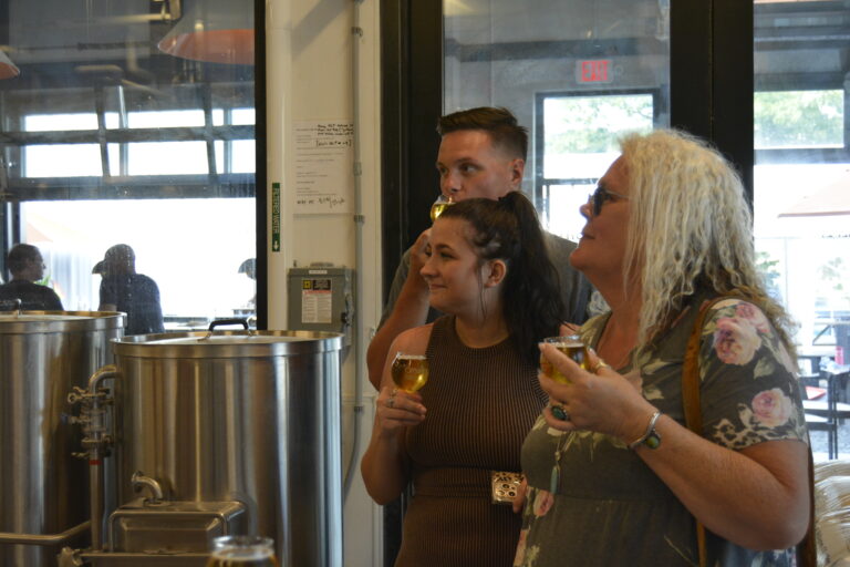 People tasting beer at Orange Bike Brewing. Photo Credit: Harleigh Gastman People tasting beer at Orange Bike Brewing. Photo Credit: Harleigh Gastman