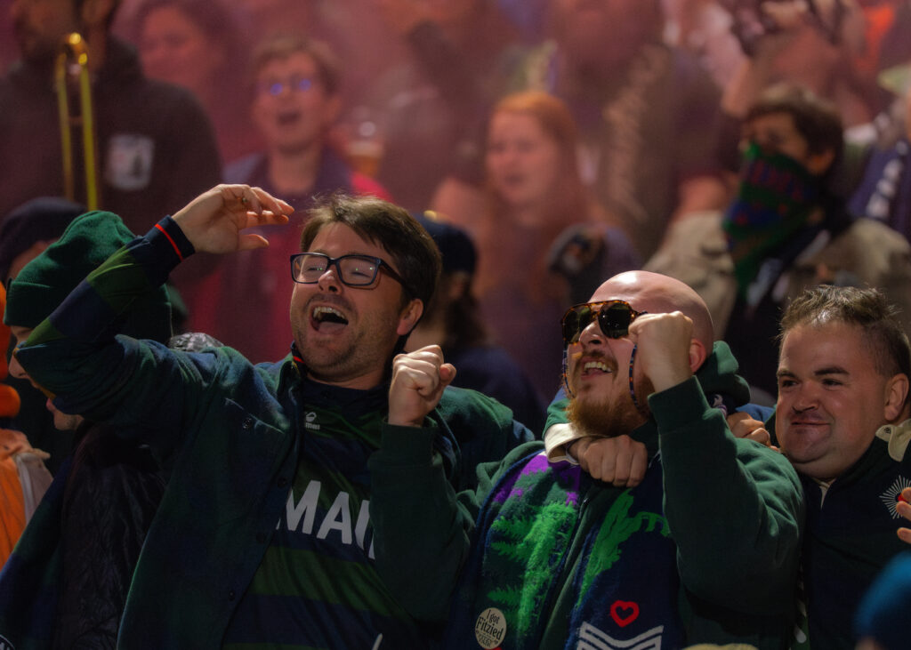People cheering at Hearts of Pine game. Photo Credit: Avery Lehman