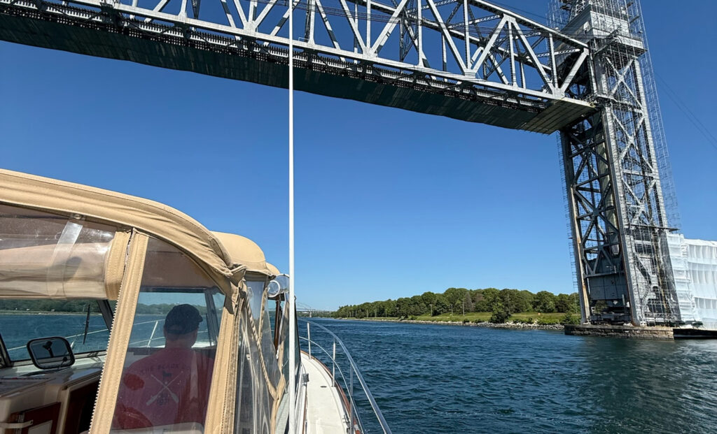 Boat Going Under Bridge. Photo Credit: Casco Bay Legacy Charters