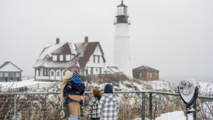 Family with Winter Portland Head Light. Photo Credit: Capshore Photography