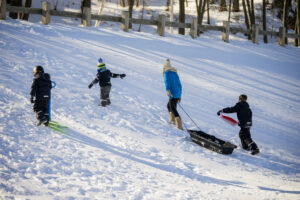 People playing in the snow. Photo credit: Capshore