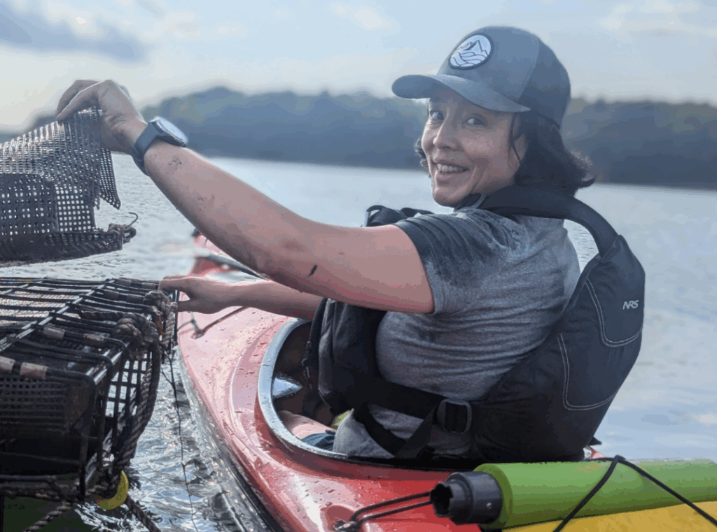 Kayaking to tend to oyster farm. Photo Credit: Indigo Oyster Company