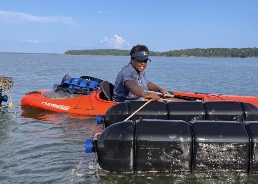 Kayaking to tend to oyster farm. Photo Credit: Indigo Oyster Company