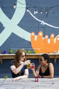 Cheers at Belleflower Brewing. Photo Credit: Capshore Photography.