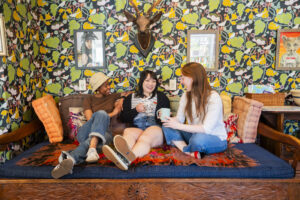 Friends in the Living Room of Black Elephant Hostel. Photo Credit: Capshore Photography.