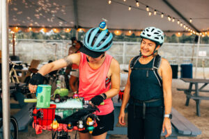 Two Women Ready to Bike. Photo credit: Navadise Media