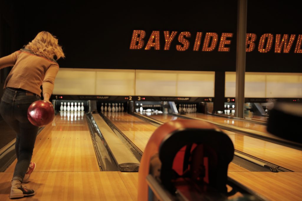 A woman bowling at Bayside Bowl in Portland, Maine. Photo credit: Knack Factory