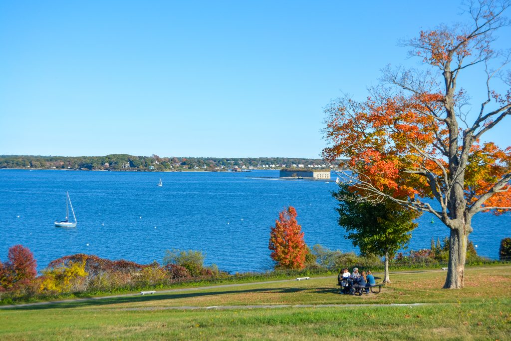 Casco Bay with sailboats and autumn trees in Portland, Maine. Photo Credit: Lauren Witt Peters