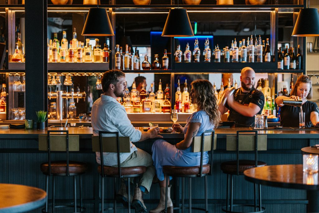 Couple with Drinks at Luna Rooftop Bar. Photo credit: Jamie Mercurio Photography