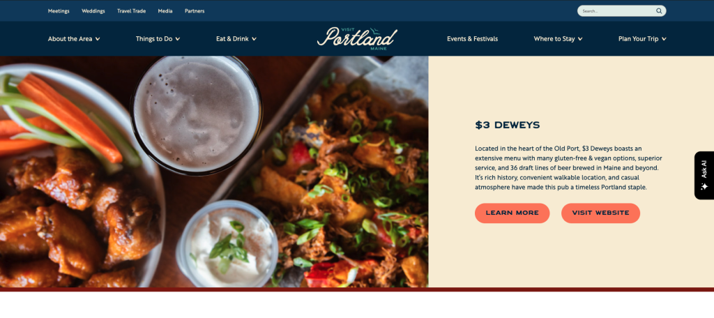 A website banner featuring a plate of chicken wings, beer, and pulled pork nachos in Portland Maine.