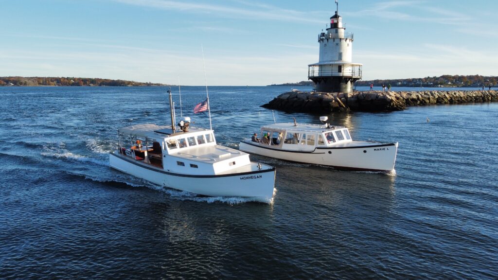 Boats cruising by lighthouse - Photo Courtesy of Casco Bay Custom Charters Boats cruising by lighthouse - Photo Courtesy of Casco Bay Custom Charters