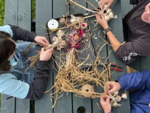 Garlic Braiding - Photo Credit: Pineland Farms