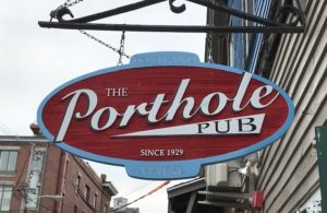 Porthole Pub Sign Hanging Over Door - Photo Courtesy of Porthole Restaurant