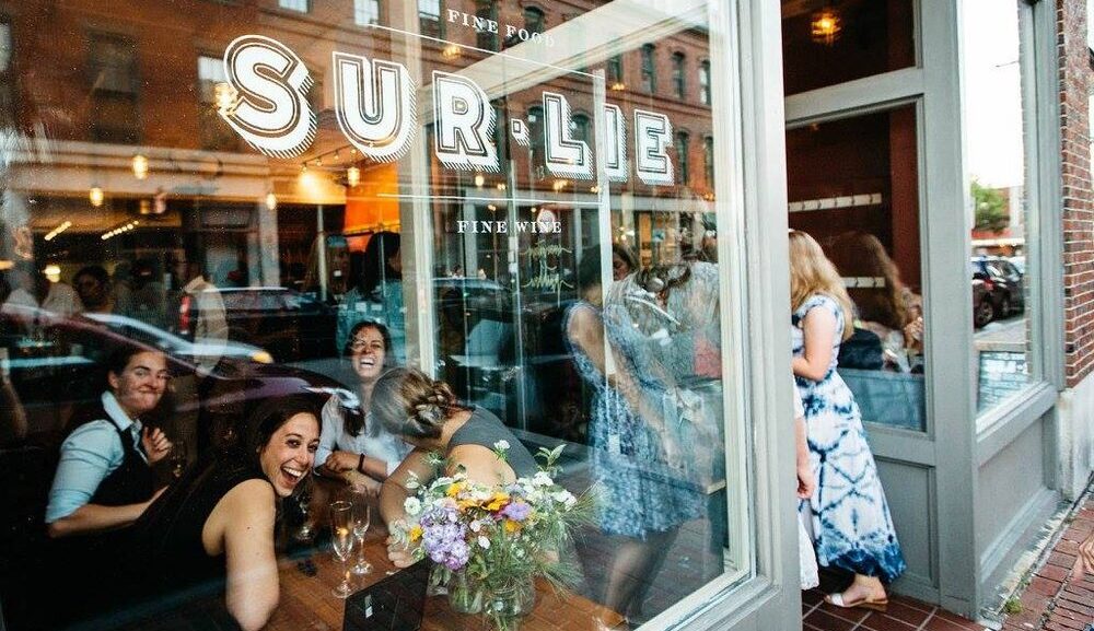 Exterior of Sur Lie with people in dining room (taken in 2019) - Photo courtesy of Wine Wise Events
