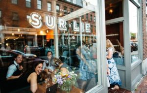 Exterior of Sur Lie with people in dining room (taken in 2019) - Photo courtesy of Wine Wise Events